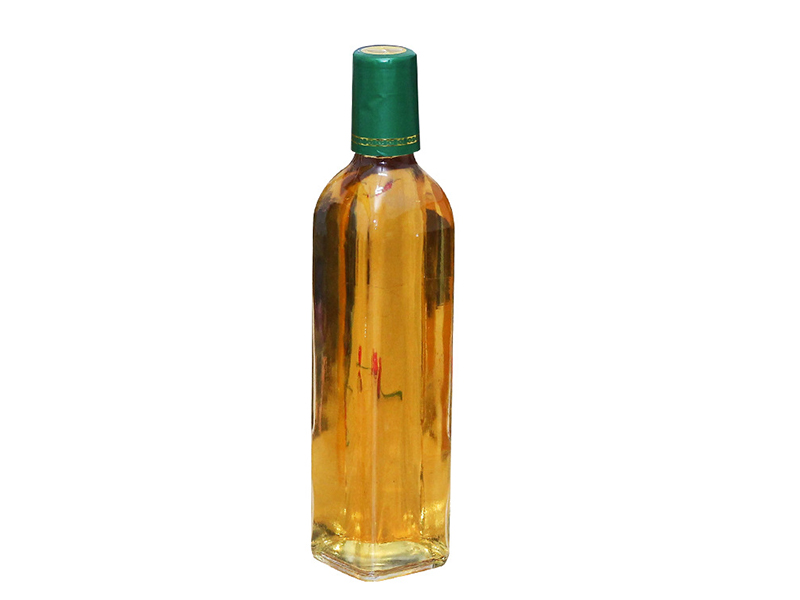 Olive oil in glass condiment bottle