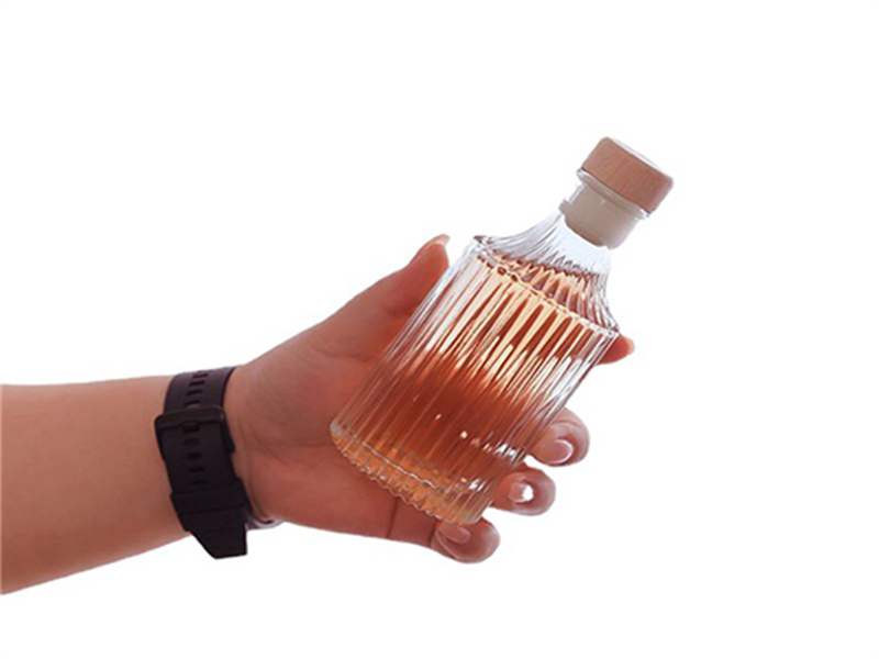 Small vertical-striped glass wine bottle