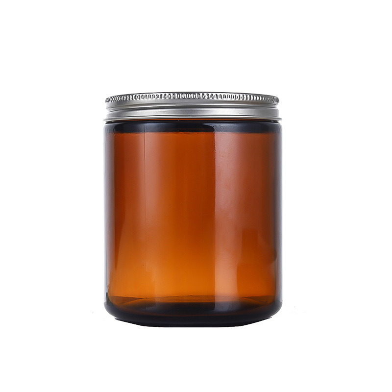 Round amber glass candle jar with metal lid